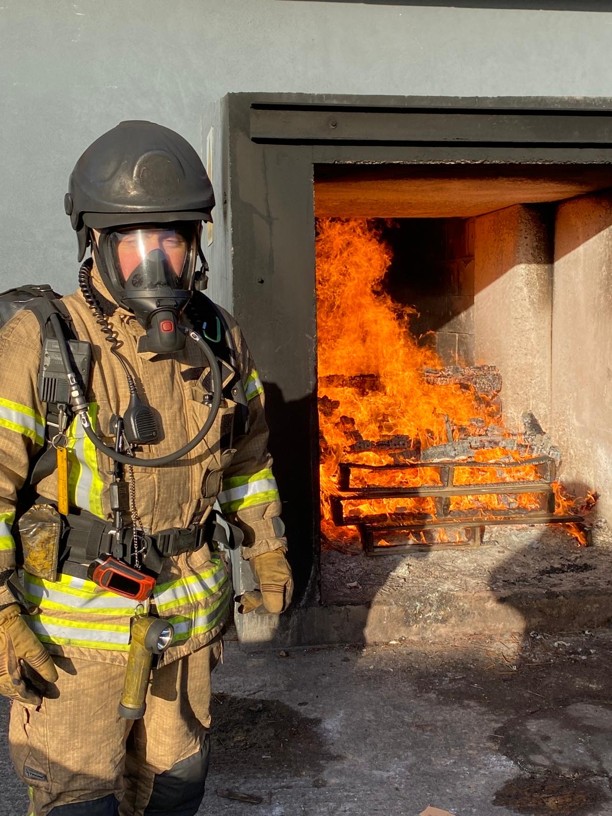 Denis O'Connell in breathing apparatus at a live fire training exercise