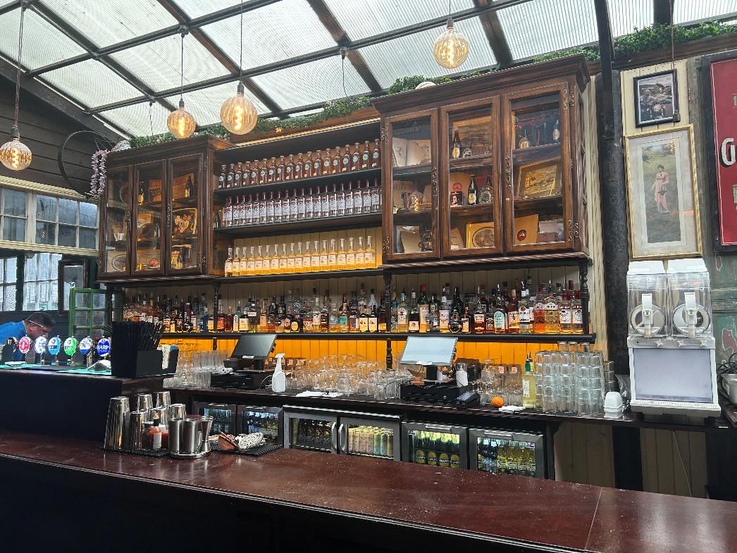 Interior of a hotel bar and nightclub premises with bar counter and glazed roof